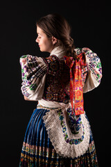 Young beautiful slovak woman in traditional dress. Slovak folklore