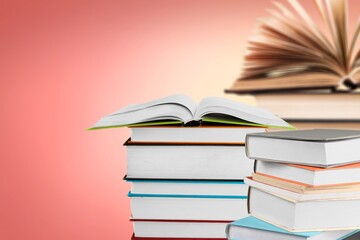 Many stacks of educational books to study in the university library on a color background