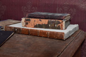 Old antique books on the table. Selective focus.