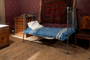 Old vintage metal bed in the interior. 