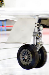 Airplane landing gear maintenance at hangar