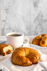 butter croissant with coffee, minimalist, breakfast. coffee shop