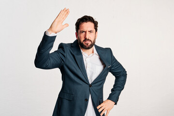 bearded adult male in jacket and shirt with copy space in a studio shot with white background. - 466605220