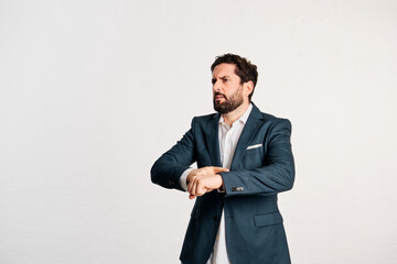 bearded adult male in jacket and shirt with copy space in a studio shot with white background. - 466605228