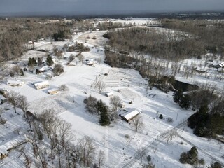 Fototapeta na wymiar Snowy neighborhood from the air