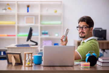 Young male designer working in the office