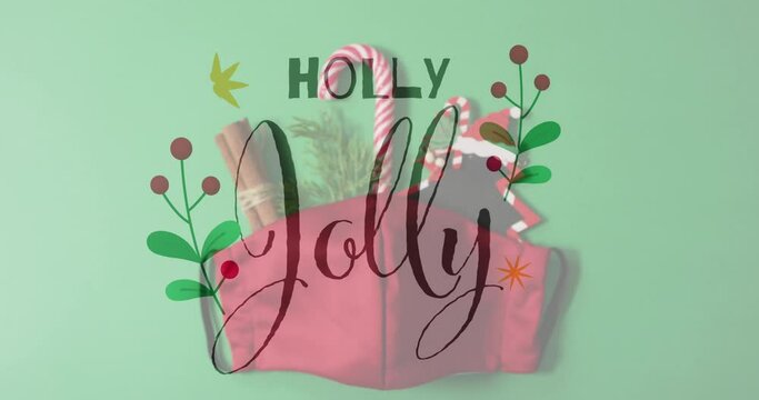 Animation of holly jolly text over christmas decorations