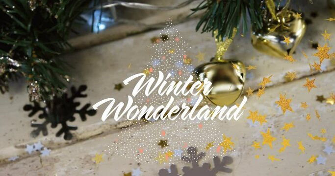 Animation of winter wonderland text over christmas decorations