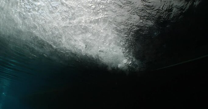 under a boat scenery underwater with a propeller