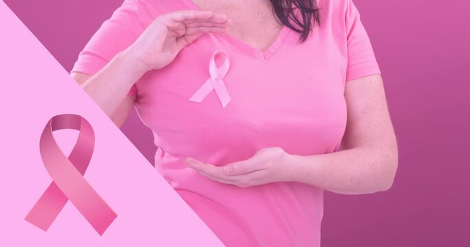 Animation of pink breast cancer ribbon over caucasian woman