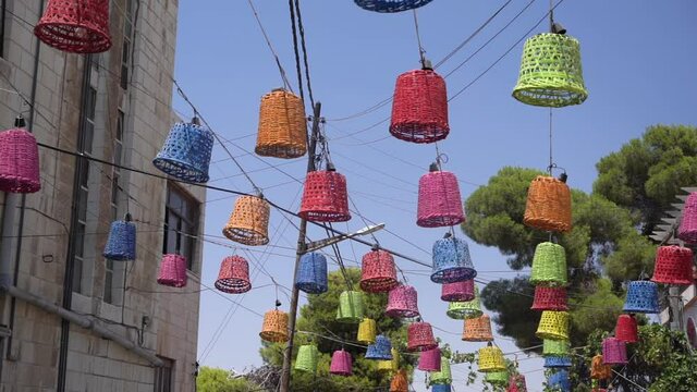 Rainbow Street, Amman, Jordan. Colorful Decoration on Wires Under Blue Sky, Full Frame