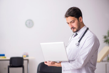 Young male doctor in telemedicine concept