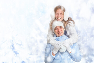 Winter portrait of the teenage girl hugging the senior