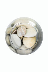 Fototapeta na wymiar beautiful sea stones in a small aquarium on a white background top view