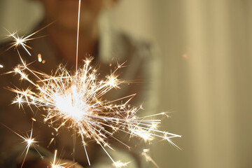 child with sparkler in the foreground