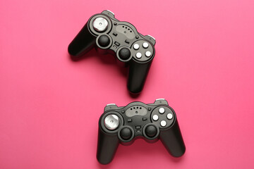 Modern joysticks on color background © Pixel-Shot