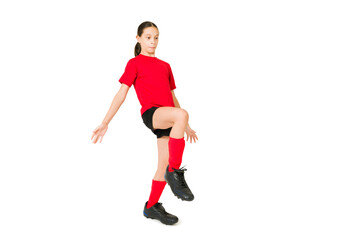 Fototapeta na wymiar Young girl controlling a soccer ball