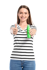 Fototapeta premium Young woman with mosquito repellent showing thumb-up on white background