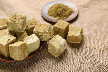 Plate with tasty hojicha marshmallows on table, closeup
