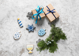 Cookies for Hanukkah celebration with gifts and Christmas decor on grunge background