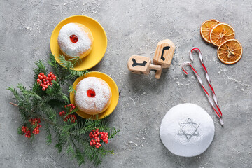 Symbols of Hanukkah with Christmas decor on grunge background