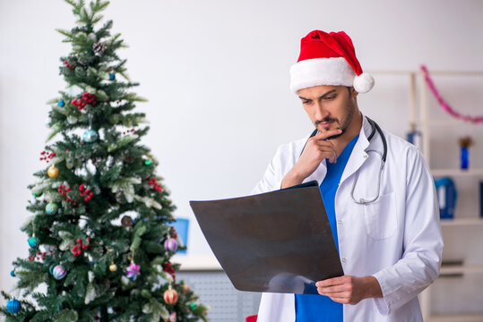 Young male doctor celebrating Christmas at the hospital