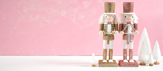 Christmas pink theme holiday background framed border banner styled with nutcrackers and ornaments...