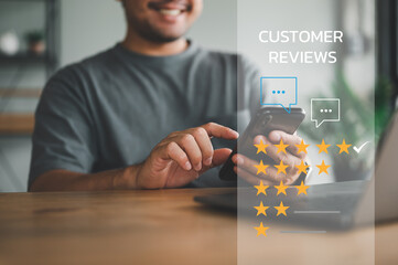 Customer service and Satisfaction concept ,Business people touching on screen smart phone choose the 5 star icon to give satisfaction in service. rating very impressed.