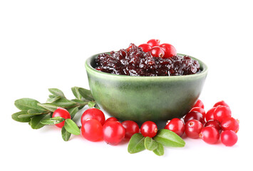 Bowl with tasty lingonberry jam and fresh berries on white background