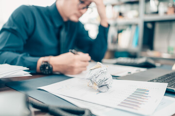 Crumpled papers on office desk. Business strain feeling was frustrated with working failed. fail, conflict, fale and problem working concept. © Charnchai saeheng