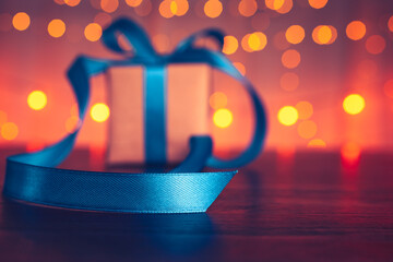 gift box, present on the table and light of bokeh background. Valentine's Day, Christmas, Birth...