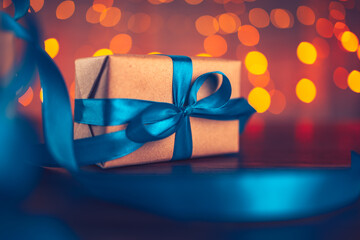 gift box, present on the table and light of bokeh background. Valentine's Day, Christmas, Birth...
