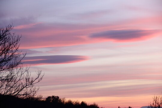 fluffy pink sunset clouds in the sky