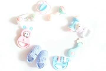 A lots of colorful rattle toys on white background.childhood, beginning childhood and Childcare concept.