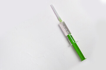 Fototapeta na wymiar Medical syringe on a white textured background, medicine, treatment of diseases.