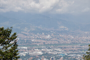 afternoon in the city of medellin from the viewpoint cloudy sky you can see the airport area
