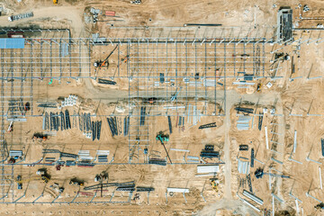 metal frame construction of modern warehouse or industrial building. aerial top view.