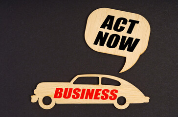 On a black background, a car with the inscription Business, above it a plate with the inscription -...