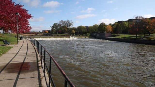 Flint River and dam in Flint, Michigan gimbal video walking.