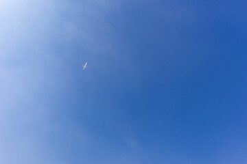 a plane flying in the sky and clouds