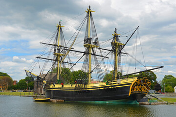 Antique ship Friendship of Salem docked at a pier in the Salem Maritime National Historic Site...