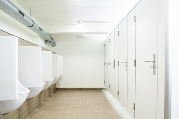 Fototapeta na wymiar urinal and toilet doors