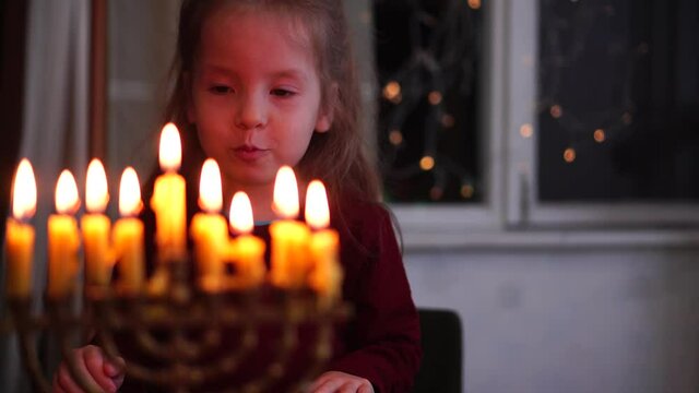Hanukkah. Child Looking at Menorah Candles. Lighting A Menorah and Jewish Holiday. Chanukah, Chanuka, Chanukkah, Hanuka