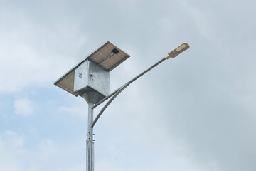 LED street light with solar cell panel on blue sky