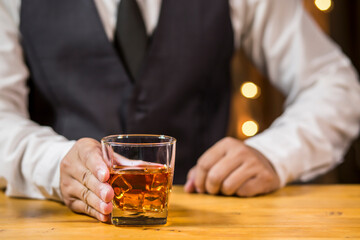 Bartender pouring Whiskey, on  bar,