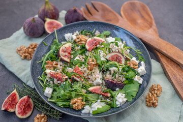 healthy barley salad with fresh figs, feta cheese and walnuts