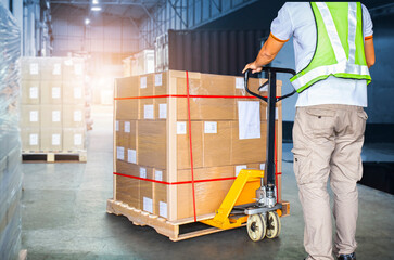 Worker Courier Unloading Package Boxes in Distribution Warehouse Center. Shipments Supply Chain Delivery service. Truck Loading at Dock Warehouse. Shipping Warehouse Logistics Transportation. © Siwakorn1933