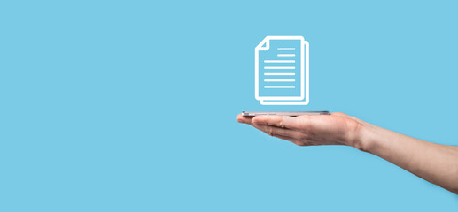 Male hand holding a document icon on blue background. Document Management Data System Business...
