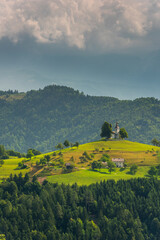Lonely Church Stand Out on Hilltop in Alpine Landscape. Sveti Tomaz in Slovenia