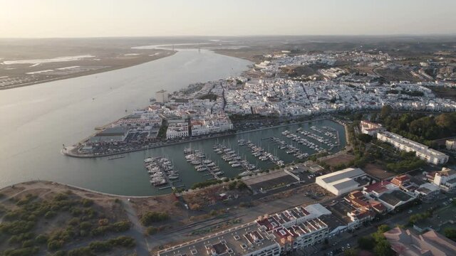 Aerial backwards view of coastal town of Ayamonte with its marina. Andalusia, Spain.
